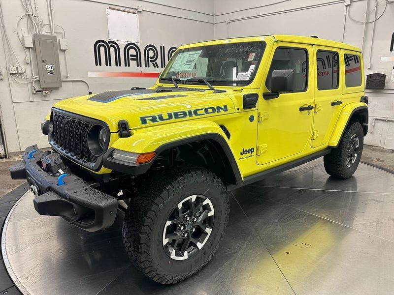 2024 Jeep Wrangler 4-door Rubicon X 4xe in a High Velocity Clear Coat exterior color and Blackinterior. Marina Auto Group (855) 564-8688 marinaautogroup.com 