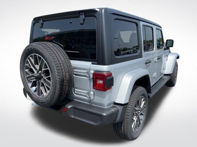 2023 Jeep Wrangler Sahara 4xe in a Silver Zynith Clear Coat exterior color and Blackinterior. Lakeshore CDJR Seaford 302-213-6058 lakeshorecdjr.com 