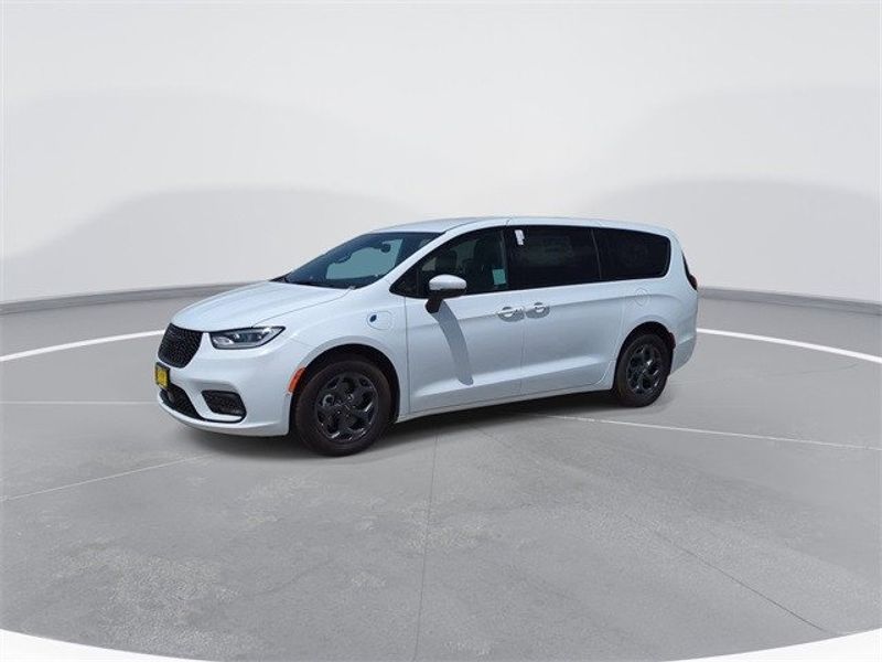 2023 Chrysler Pacifica Plug-in Hybrid Touring L in a Bright White Clear Coat exterior color and Blackinterior. McPeek