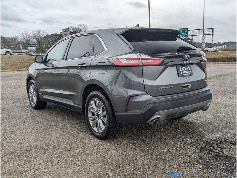 2022 Ford Edge Titanium in a Carbonized Gray Metallic exterior color and Medium Soft Ceramicinterior. Johnson Dodge 601-693-6343 pixelmotiondemo.com 