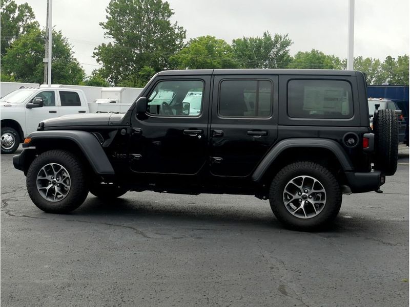 2024 Jeep Wrangler 4-door Sport S in a Black Clear Coat exterior color and Blackinterior. Paul Sherry Chrysler Dodge Jeep RAM (937) 749-7061 sherrychrysler.net 