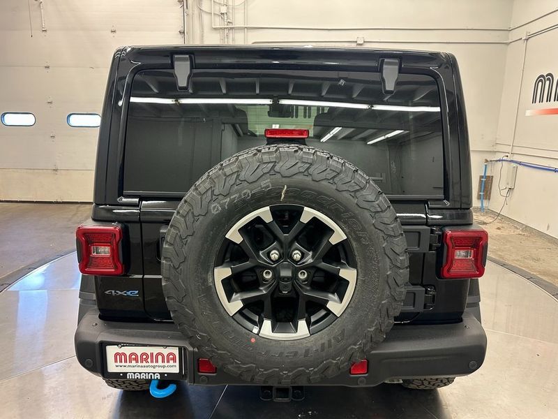 2024 Jeep Wrangler 4-door Rubicon X 4xe in a Black Clear Coat exterior color and Blackinterior. Marina Auto Group (855) 564-8688 marinaautogroup.com 