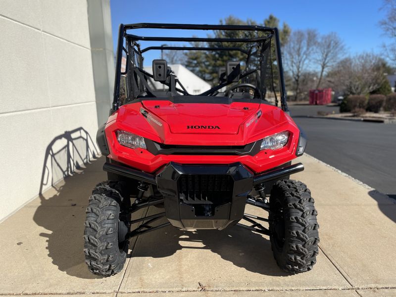 2023 Honda PIONEER 1000 DELUXE CREW  in a RED exterior color. Cross Country Powersports 732-491-2900 crosscountrypowersports.com 