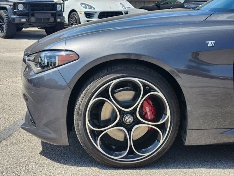 2024 Alfa Romeo Giulia Ti in a Vesuvio Gray Metallic exterior color and Blackinterior. Northside Imports Houston 281-475-4549 northsideimportshouston.com 