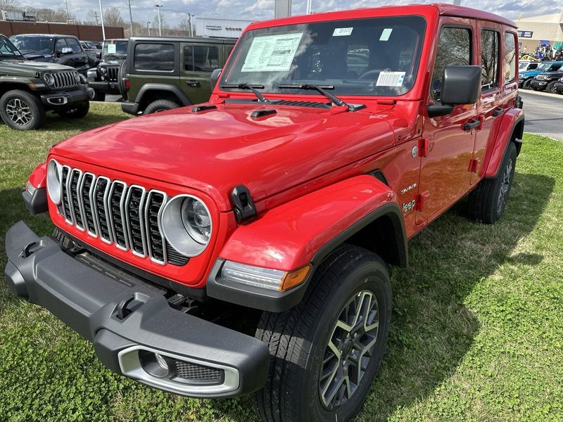 2024 Jeep Wrangler 4-door Sahara in a Firecracker Red Clear Coat exterior color. Gupton Motors Inc 615-384-2886 guptonmotors.com 