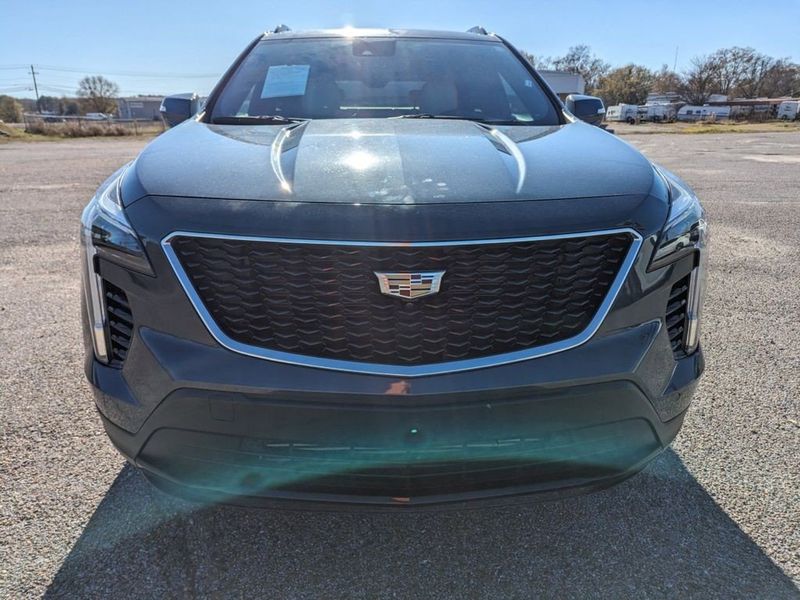 2021 Cadillac XT4 AWD Sport in a Shadow Metallic exterior color and Light Wheat/Jet Black w/Red Accentsinterior. Johnson Dodge 601-693-6343 pixelmotiondemo.com 