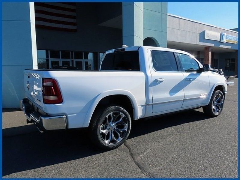 2024 RAM 1500 Limited in a Ivory White Tri Coat Pearl Coat exterior color and Blackinterior. Papas Jeep Ram In New Britain, CT 860-356-0523 papasjeepram.com 