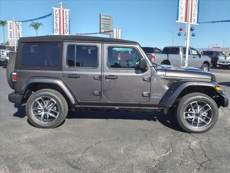 2024 Jeep Wrangler Sport S 4xe in a Granite Crystal Metallic Clear Coat exterior color and Blackinterior. Perris Valley Auto Center 951-657-6100 perrisvalleyautocenter.com 