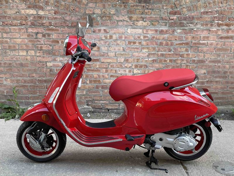 2023 Vespa Primavera 50 (red)   in a red exterior color. Motoworks Chicago 312-738-4269 motoworkschicago.com 