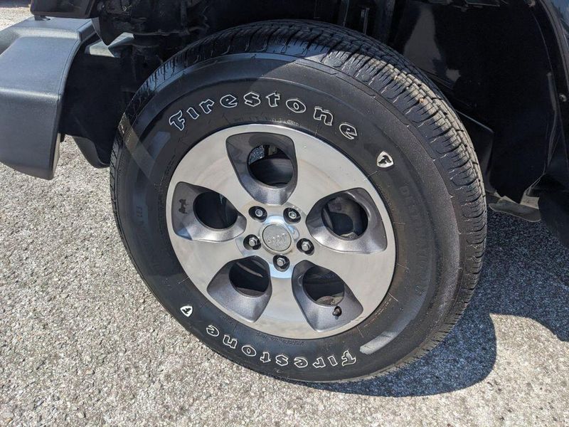 2017 Jeep Wrangler Unlimited Sahara in a Black Clear Coat exterior color and Blackinterior. Johnson Dodge 601-693-6343 pixelmotiondemo.com 