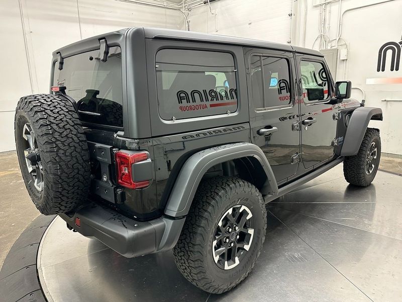 2024 Jeep Wrangler 4-door Rubicon 4xe in a Black Clear Coat exterior color and Blackinterior. Marina Auto Group (855) 564-8688 marinaautogroup.com 