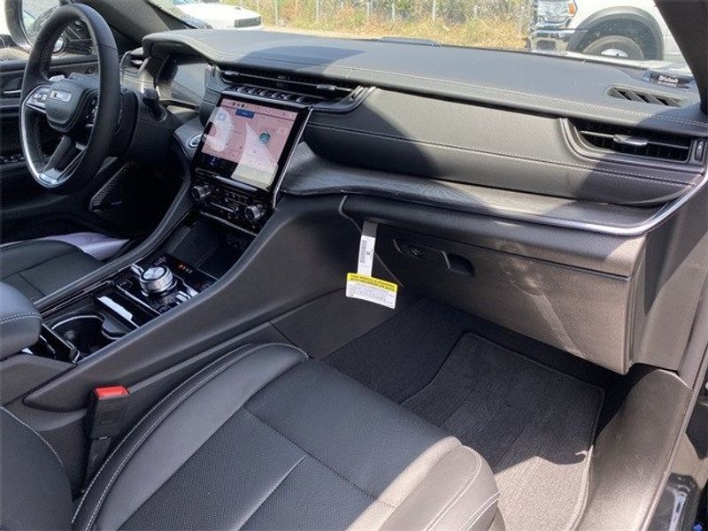 2023 Jeep Grand Cherokee Overland 4xe in a Diamond Black Crystal Pearl Coat exterior color and Global Blackinterior. McPeek