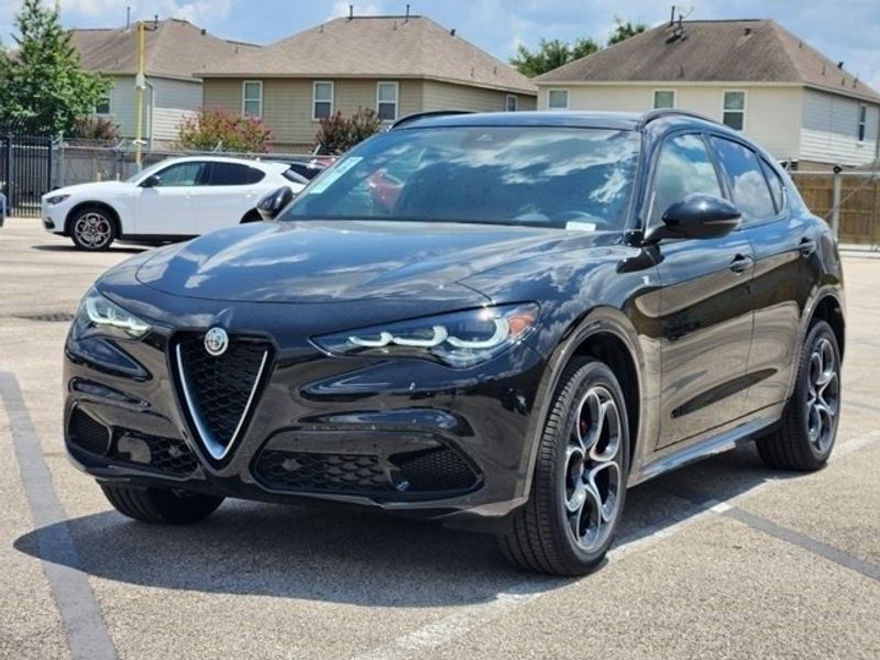 2024 Alfa Romeo Stelvio Ti Awd in a Vulcano Black Metallic exterior color and Chocolateinterior. Northside Alfa Romeo of Houston 281-475-4549 alfaromeousaofnorthhouston.com 