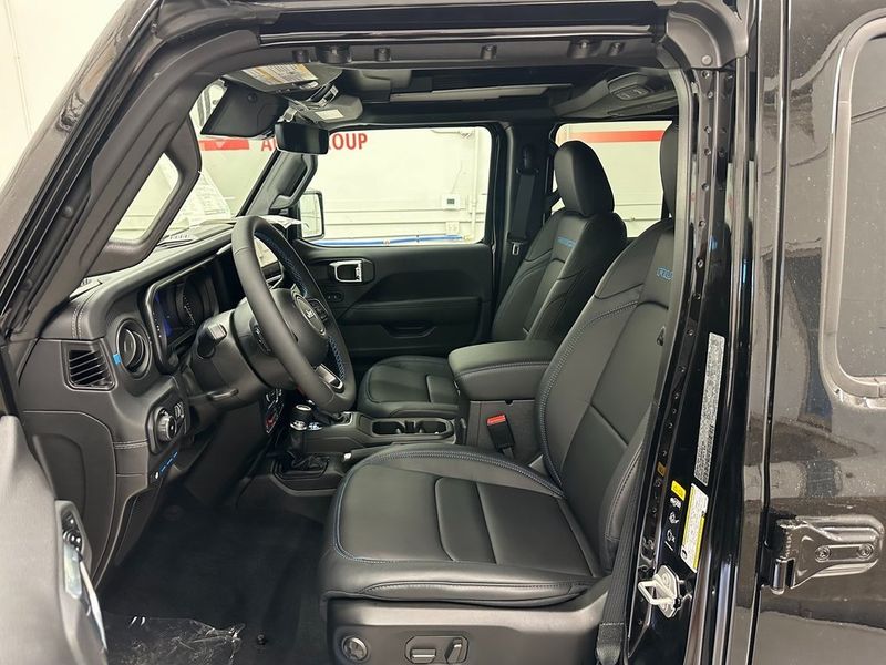 2024 Jeep Wrangler 4-door Rubicon X 4xe in a Black Clear Coat exterior color and Blackinterior. Marina Auto Group (855) 564-8688 marinaautogroup.com 