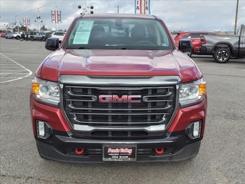 2021 GMC Canyon AT4 w/Cloth in a Cayenne Red Tint Coat exterior color and Jet Black/Kalahariinterior. Perris Valley Auto Center 951-657-6100 perrisvalleyautocenter.com 