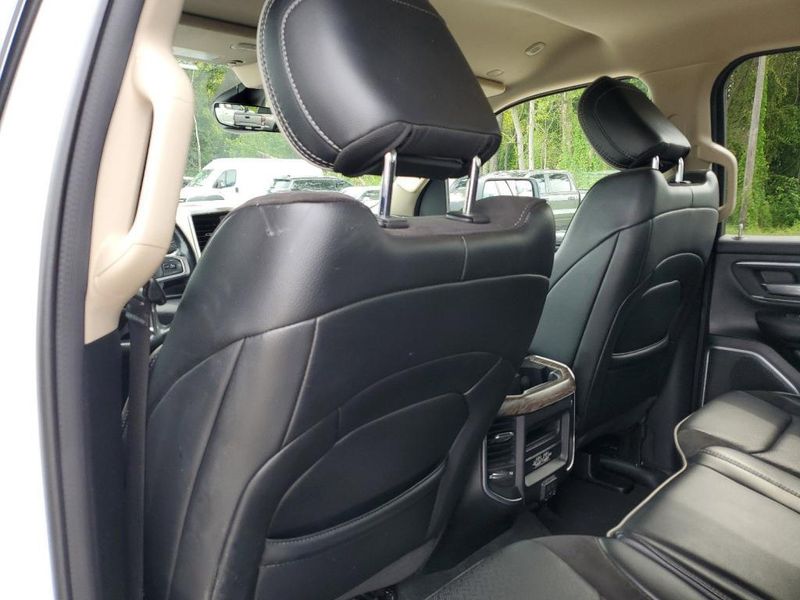 2020 RAM 1500 Laramie in a Bright White Clear Coat exterior color and Blackinterior. Johnson Dodge 601-693-6343 pixelmotiondemo.com 