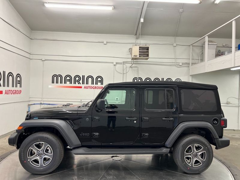 2023 Jeep Wrangler 4-door Sport S 4x4 in a Black Clear Coat exterior color and Blackinterior. Marina Chrysler Dodge Jeep RAM (855) 616-8084 marinadodgeny.com 