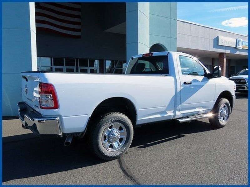 2024 RAM 2500 Tradesman in a Bright White Clear Coat exterior color and Diesel Gray/Blackinterior. Papas Jeep Ram In New Britain, CT 860-356-0523 papasjeepram.com 