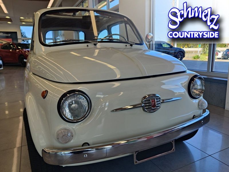 1967 Fiat 500 Model F w/al Fresco Top in a White exterior color and Redinterior. Schmelz Countryside SAAB (888) 558-1064 stpaulsaab.com 