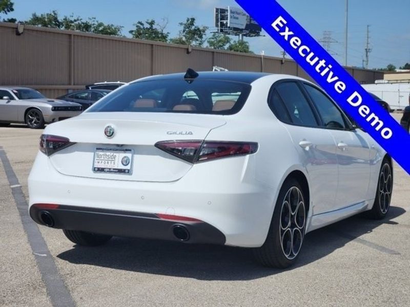 2024 Alfa Romeo Giulia Ti in a Alfa White exterior color and Saddle Browninterior. Northside Imports Houston 281-475-4549 northsideimportshouston.com 