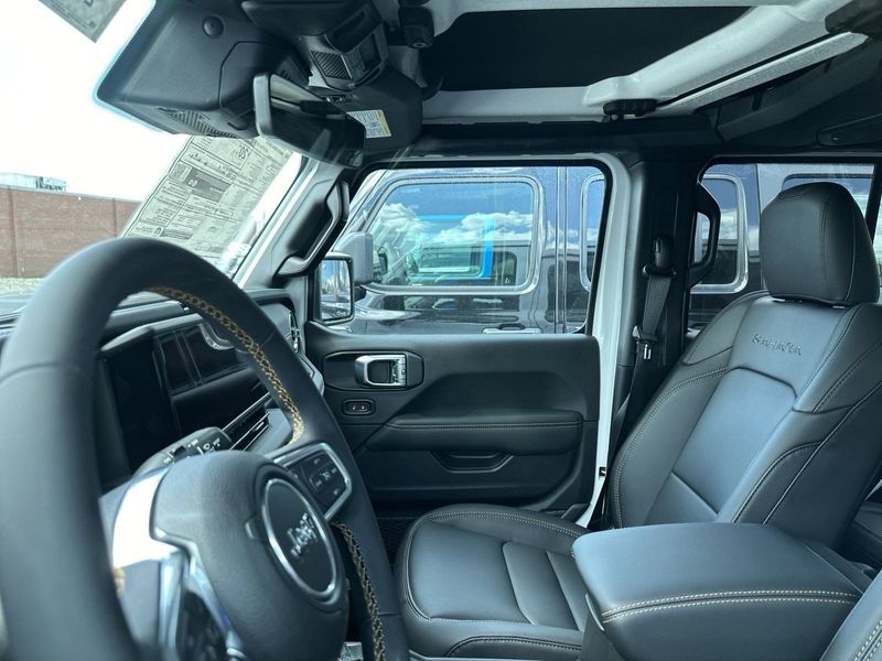 2024 Jeep Wrangler 4-door Sahara in a Bright White Clear Coat exterior color. Gupton Motors Inc 615-384-2886 guptonmotors.com 