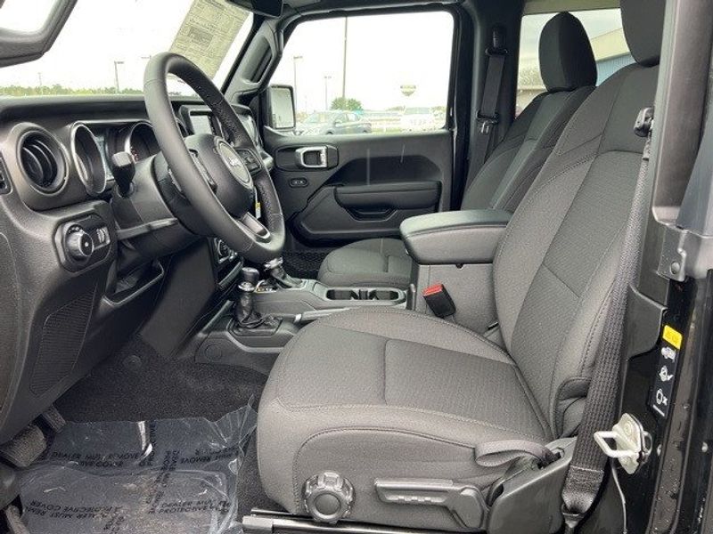 2023 Jeep Wrangler 2-door Sport S 4x4 in a Black Clear Coat exterior color and Blackinterior. Lakeshore CDJR Seaford 302-213-6058 lakeshorecdjr.com 