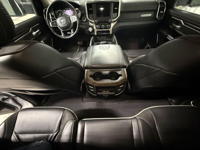 Used 2020 RAM 1500 Laramie in a Bright White Clear Coat exterior color and Blackinterior. Thys Motor Company 319-318-6640 thysmotorco.com 