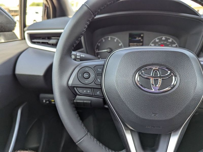 2023 Toyota Corolla SE in a Midnight Black Metallic exterior color and Black/Redinterior. Johnson Dodge 601-693-6343 pixelmotiondemo.com 