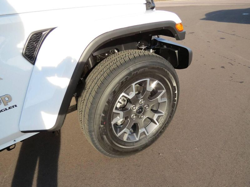 2024 Jeep Wrangler 4-door Sahara in a Bright White Clear Coat exterior color and Blackinterior. Militello Motors ​507-200-4344 militellomotors.net 