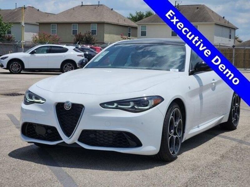 2024 Alfa Romeo Giulia Ti in a Alfa White exterior color and Saddle Browninterior. Northside Imports Houston 281-475-4549 northsideimportshouston.com 