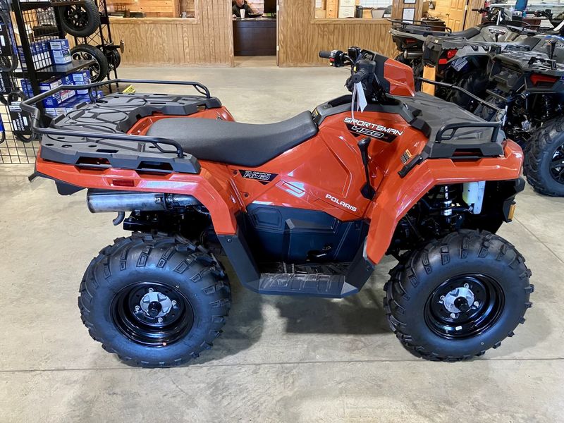 2024 Polaris Sportsman 450 H.O. EPS in a Orange exterior color. Genuine RV & Powersports (936) 569-2523 