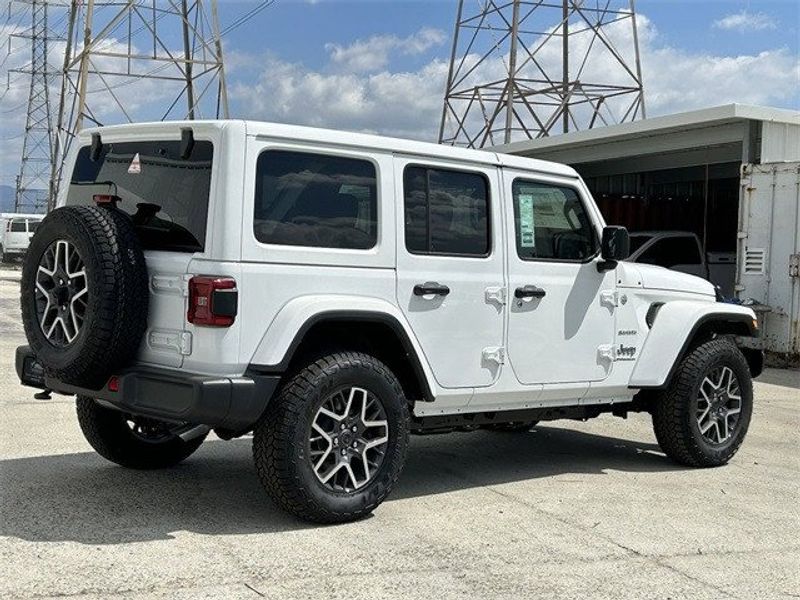 Jeep Wrangler 4xE Sahara in a Bright White Clear Coat exterior color and Blackinterior. McPeek