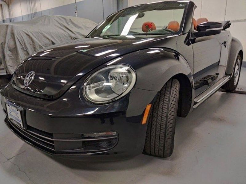 2015 VOLKSWAGEN BEETLE CONVERTIBLE 1.8T CLASSIC W/NAV in a Black Uni/Black Roof exterior color and Beige/Brown Checkered Heated Seatsinterior. Schmelz Countryside SAAB (888) 558-1064 stpaulsaab.com 