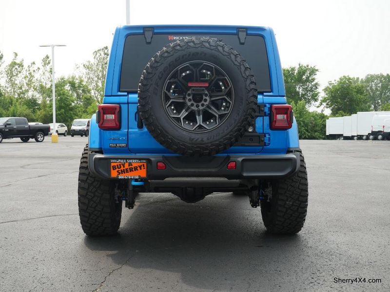 2023 Jeep Wrangler Rubicon 4xe in a Hydro Blue Pearl Coat exterior color and Black/Dark Saddleinterior. Paul Sherry Chrysler Dodge Jeep RAM (937) 749-7061 sherrychrysler.net 