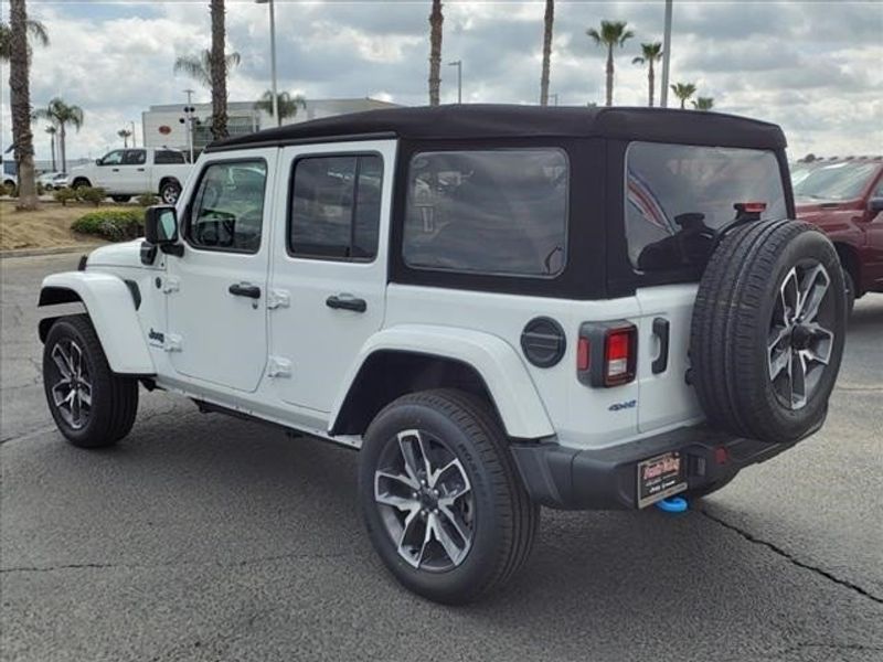 2024 Jeep Wrangler 4-door Sport S 4xe in a Bright White Clear Coat exterior color and Blackinterior. Perris Valley Chrysler Dodge Jeep Ram 951-355-1970 perrisvalleydodgejeepchrysler.com 