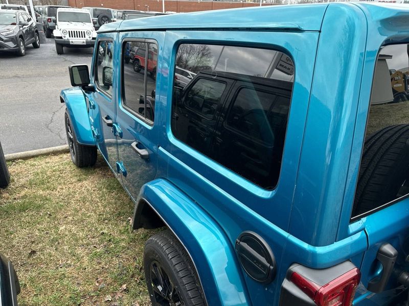 2024 Jeep Wrangler 4-door Sahara 4xe in a Bikini Pearl Coat exterior color. Gupton Motors Inc 615-384-2886 guptonmotors.com 