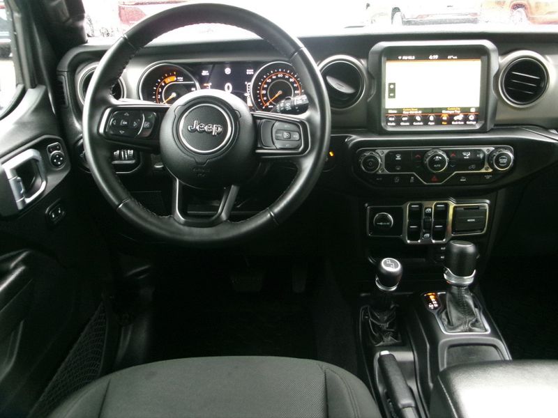 2022 Jeep Wrangler Unlimited Sport S in a Granite Crystal Metallic Clear Coat exterior color and Blackinterior. Lakeshore Chrysler Jeep Dodge (231) 500-5209 lakeshorechryslerjeep.com 