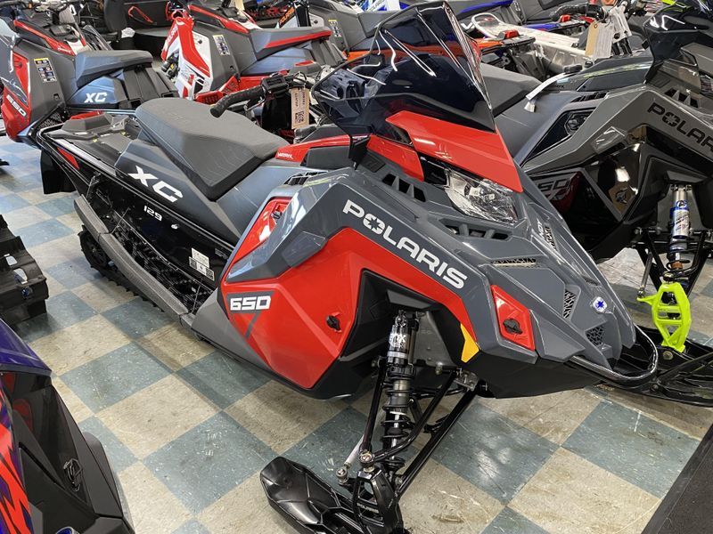 2024 Polaris INDY XC 129 in a Indy Red/Stealth Gray exterior color. Plaistow Powersports (603) 819-4400 plaistowpowersports.com 