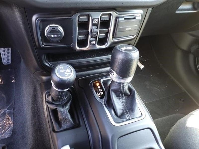 2024 Jeep Wrangler Sahara 4xe in a Black Clear Coat exterior color and Blackinterior. Perris Valley Auto Center 951-657-6100 perrisvalleyautocenter.com 