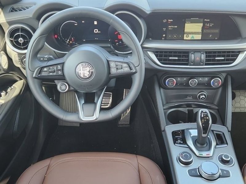 2024 Alfa Romeo Stelvio Ti Awd in a Vesuvio Gray Metallic exterior color and Chocolateinterior. Northside Alfa Romeo of Houston 281-475-4549 alfaromeousaofnorthhouston.com 