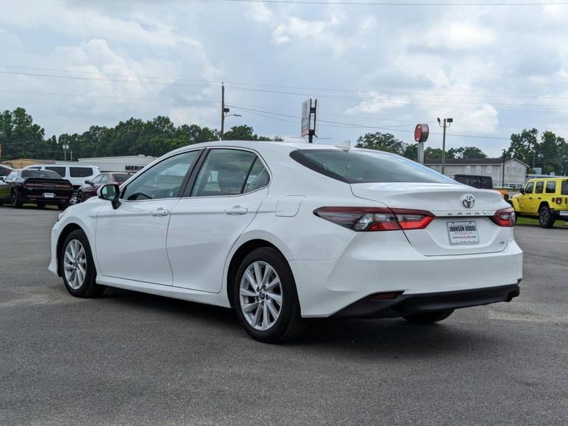 2022 Toyota Camry LE in a WHITE exterior color. Johnson Dodge 601-693-6343 pixelmotiondemo.com 