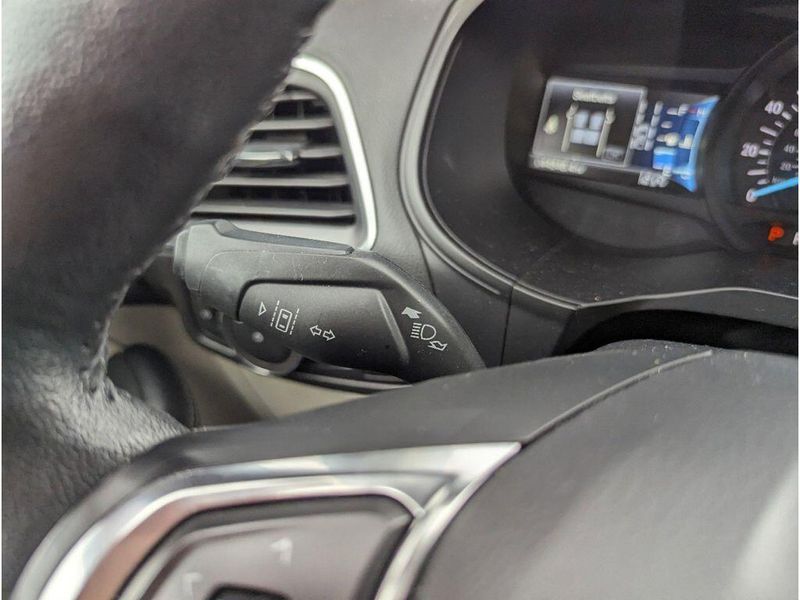 2022 Ford Edge Titanium in a Carbonized Gray Metallic exterior color and Medium Soft Ceramicinterior. Johnson Dodge 601-693-6343 pixelmotiondemo.com 