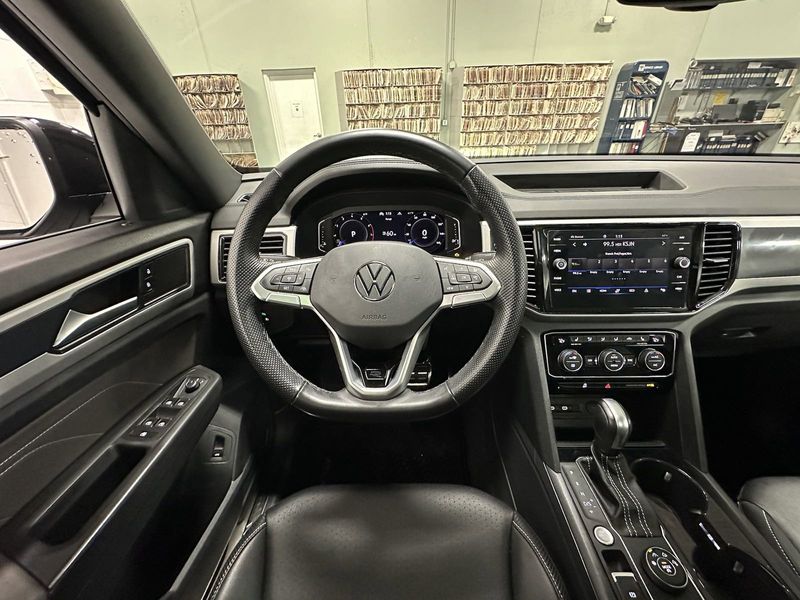 2023 Volkswagen Atlas Cross Sport SEL R-Line Black AWD w/Sunroof in a Deep Black Pearl exterior color and Black Heated Seatsinterior. Schmelz Countryside SAAB (888) 558-1064 stpaulsaab.com 