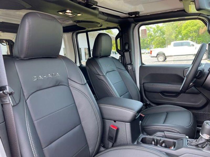 2023 Jeep Wrangler Sahara 4xe in a Silver Zynith Clear Coat exterior color and Blackinterior. Lakeshore CDJR Seaford 302-213-6058 lakeshorecdjr.com 