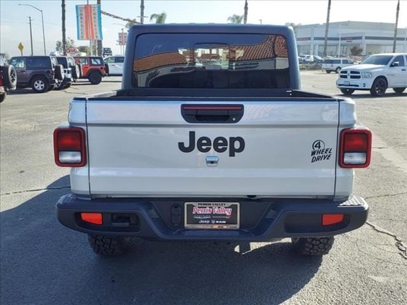 2023 Jeep Gladiator Sport in a Silver Zynith Clear Coat exterior color and Blackinterior. Perris Valley Auto Center 951-657-6100 perrisvalleyautocenter.com 
