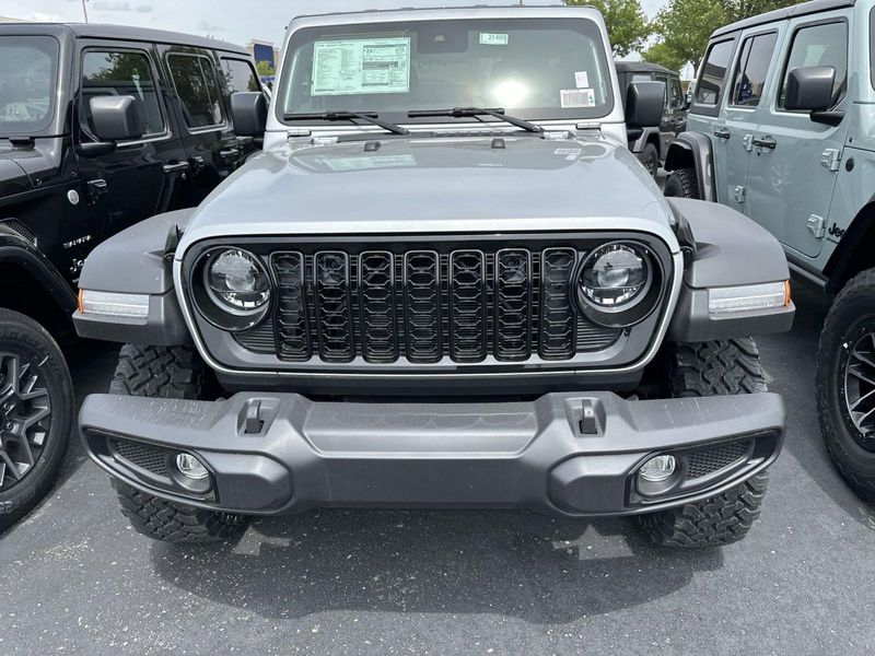 2024 Jeep Wrangler 4-door Willys in a Silver Zynith Clear Coat exterior color and Blackinterior. Gupton Motors Inc 615-384-2886 guptonmotors.com 