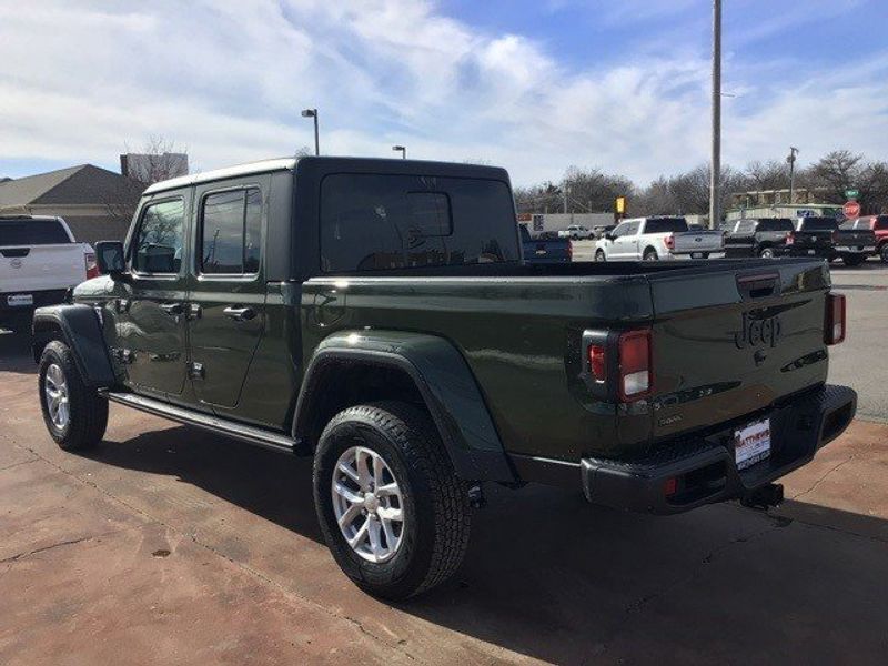 2023 Jeep Gladiator Sport S 4x4 in a Sarge Green Clear Coat exterior color and Blackinterior. Matthews Chrysler Dodge Jeep Ram 918-276-8729 cyclespecialties.com 