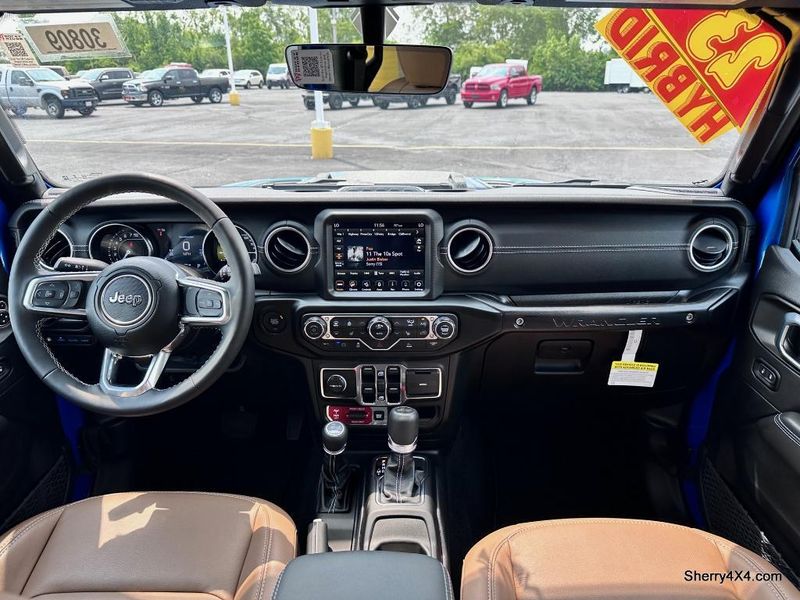 2023 Jeep Wrangler Rubicon 4xe in a Hydro Blue Pearl Coat exterior color and Black/Dark Saddleinterior. Paul Sherry Chrysler Dodge Jeep RAM (937) 749-7061 sherrychrysler.net 