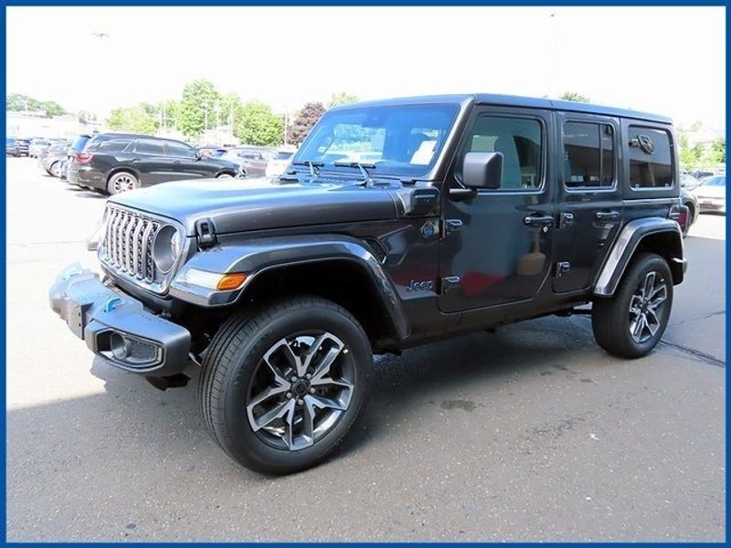 2024 Jeep Wrangler 4xE Sport 4xe in a Granite Crystal Metallic Clear Coat exterior color and Blackinterior. Papas Jeep Ram In New Britain, CT 860-356-0523 papasjeepram.com 