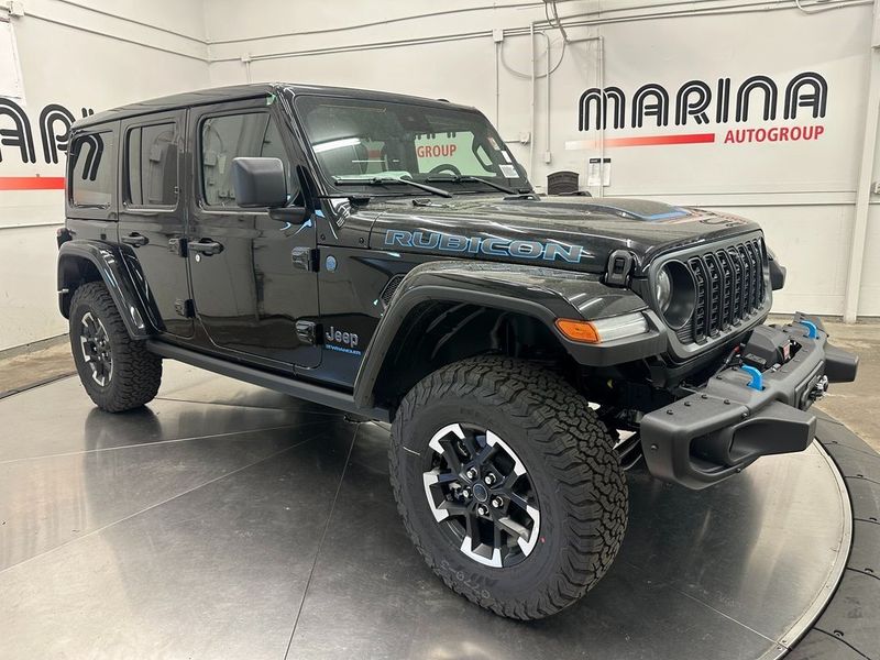 2024 Jeep Wrangler 4-door Rubicon X 4xe in a Black Clear Coat exterior color and Blackinterior. Marina Chrysler Dodge Jeep RAM (855) 616-8084 marinadodgeny.com 